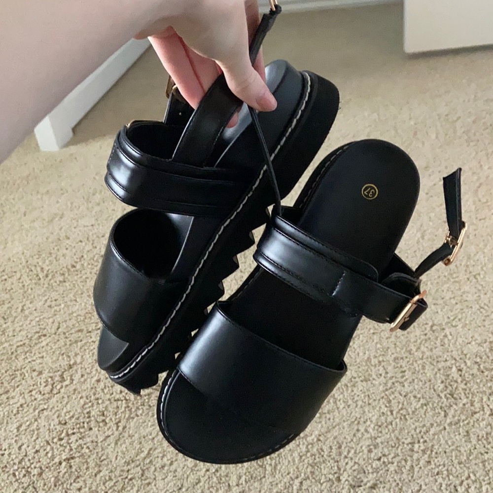 Chunky black sandals with gold buckle